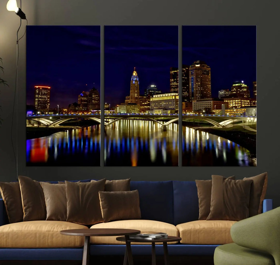 The "Columbus City Lights Night Skyline Cityscape View Wall Art Canvas Print" showcases a stunning city skyline at night, with illuminated buildings and bridges reflecting in the river, on a museum-quality canvas ready to hang.