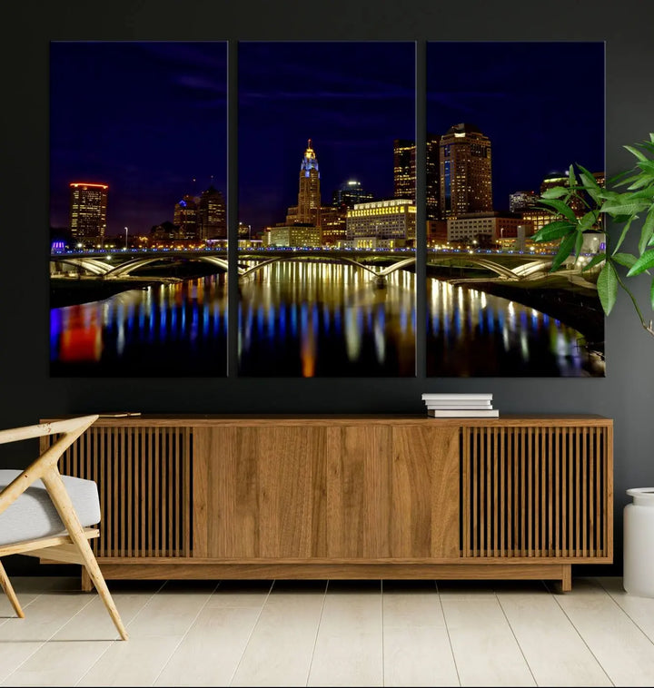 The "Columbus City Lights Night Skyline Cityscape View Wall Art Canvas Print" showcases a stunning city skyline at night, with illuminated buildings and bridges reflecting in the river, on a museum-quality canvas ready to hang.