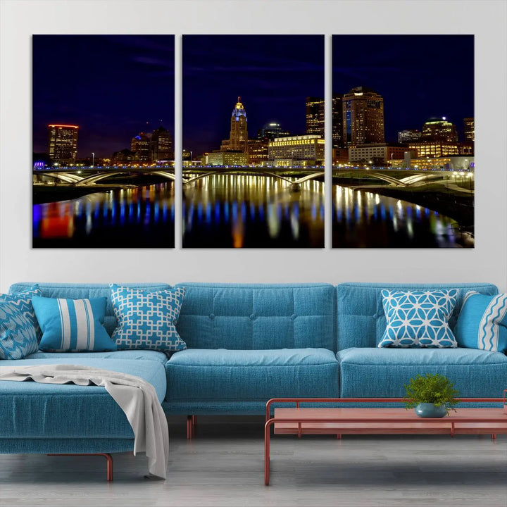 The "Columbus City Lights Night Skyline Cityscape View Wall Art Canvas Print" showcases a stunning city skyline at night, with illuminated buildings and bridges reflecting in the river, on a museum-quality canvas ready to hang.