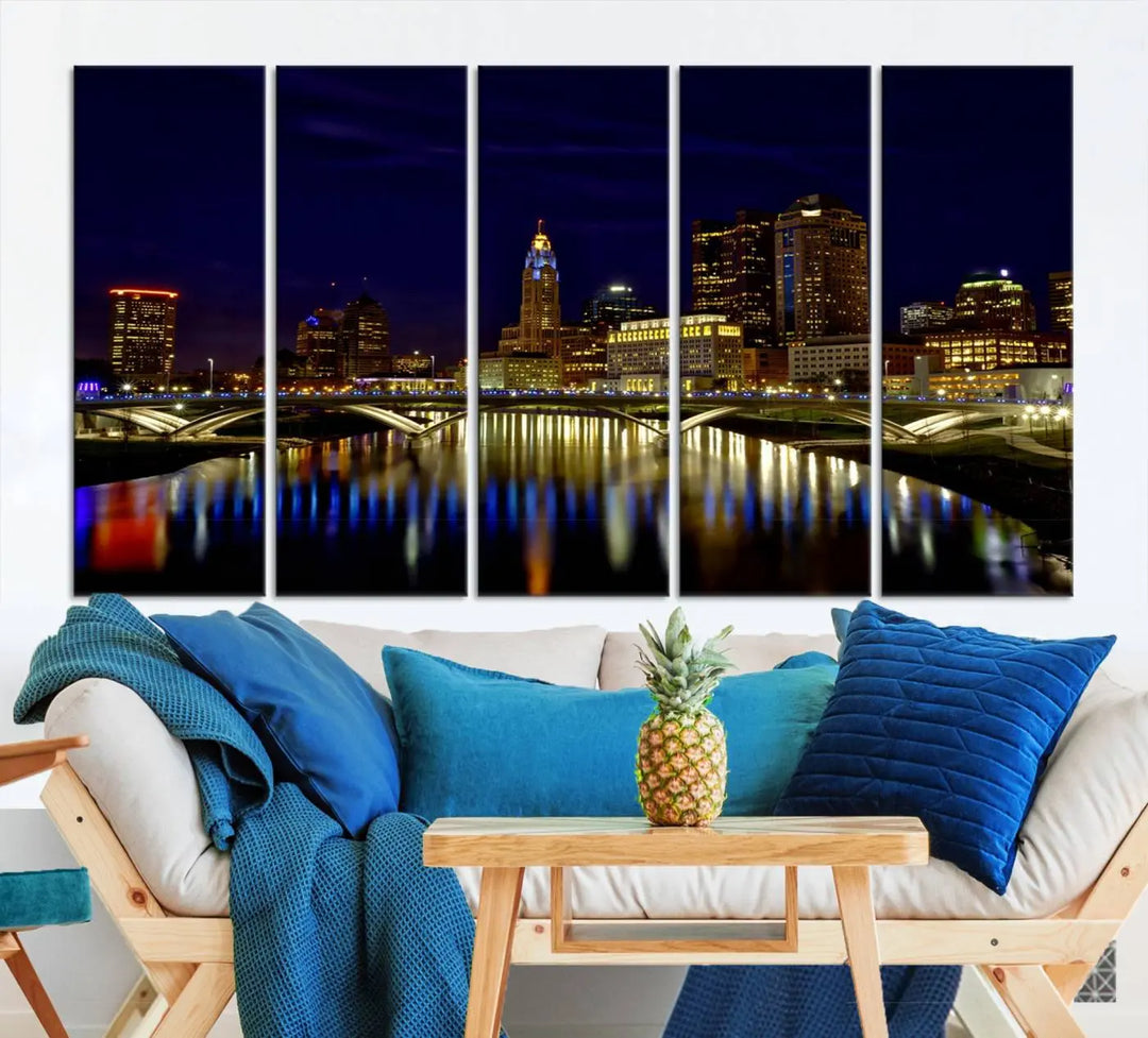 The "Columbus City Lights Night Skyline Cityscape View Wall Art Canvas Print" showcases a stunning city skyline at night, with illuminated buildings and bridges reflecting in the river, on a museum-quality canvas ready to hang.