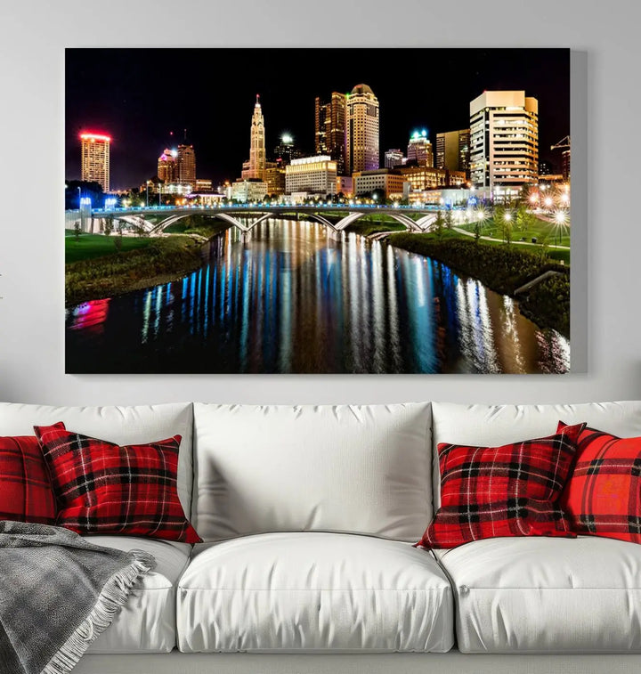 A triptych of the Columbus City Lights Night Skyline Cityscape View Wall Art Canvas Print is displayed, serving as a striking focal point in the room.