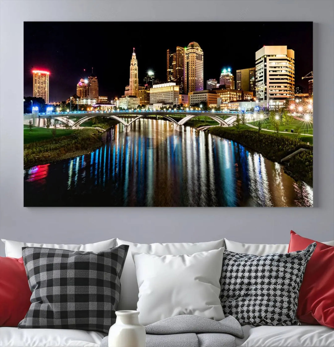 A triptych of the Columbus City Lights Night Skyline Cityscape View Wall Art Canvas Print is displayed, serving as a striking focal point in the room.