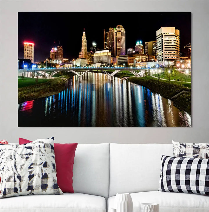 A triptych of the Columbus City Lights Night Skyline Cityscape View Wall Art Canvas Print is displayed, serving as a striking focal point in the room.