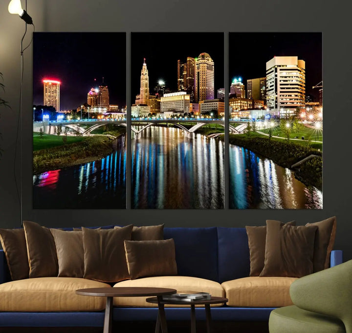 A triptych of the Columbus City Lights Night Skyline Cityscape View Wall Art Canvas Print is displayed, serving as a striking focal point in the room.