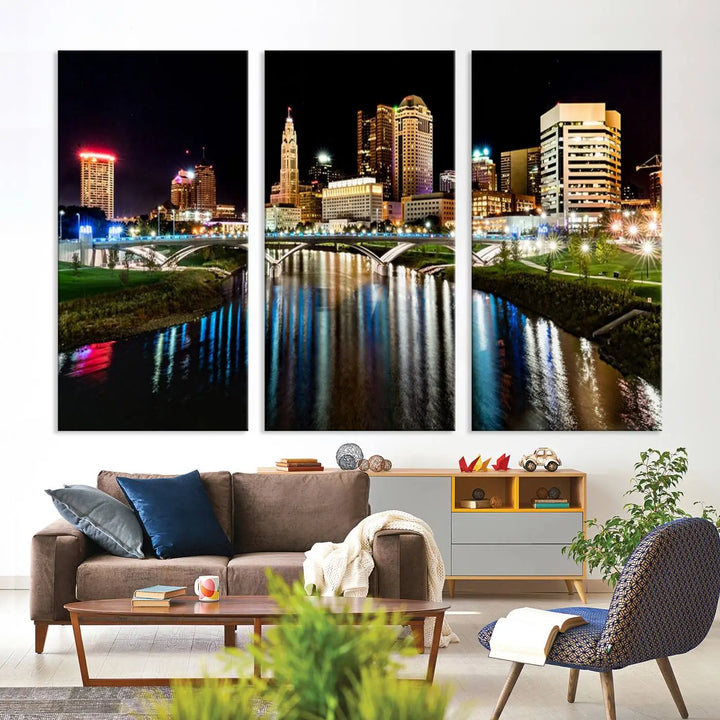 A triptych of the Columbus City Lights Night Skyline Cityscape View Wall Art Canvas Print is displayed, serving as a striking focal point in the room.