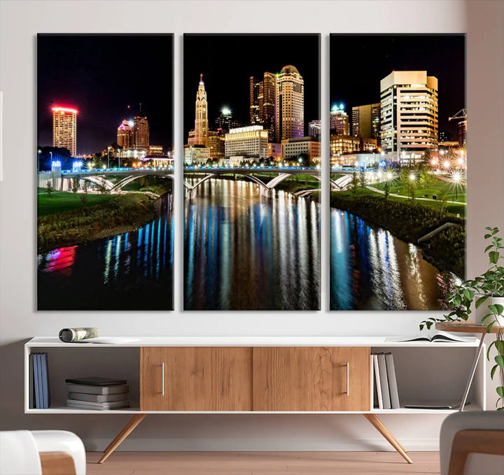 A triptych of the Columbus City Lights Night Skyline Cityscape View Wall Art Canvas Print is displayed, serving as a striking focal point in the room.