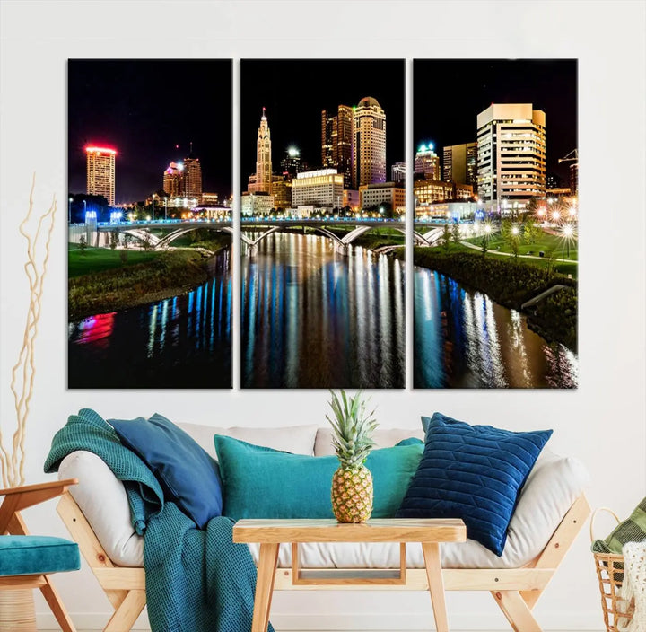 A triptych of the Columbus City Lights Night Skyline Cityscape View Wall Art Canvas Print is displayed, serving as a striking focal point in the room.