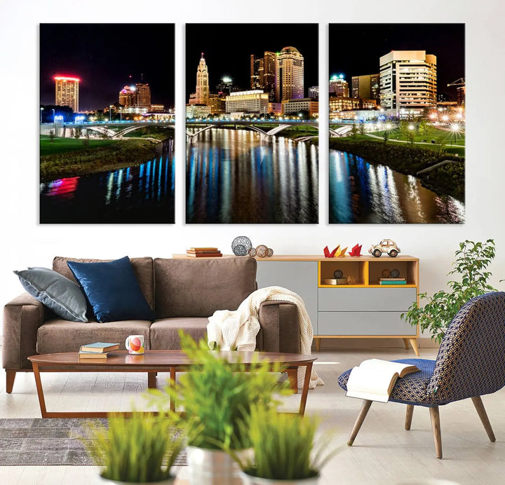 A triptych of the Columbus City Lights Night Skyline Cityscape View Wall Art Canvas Print is displayed, serving as a striking focal point in the room.