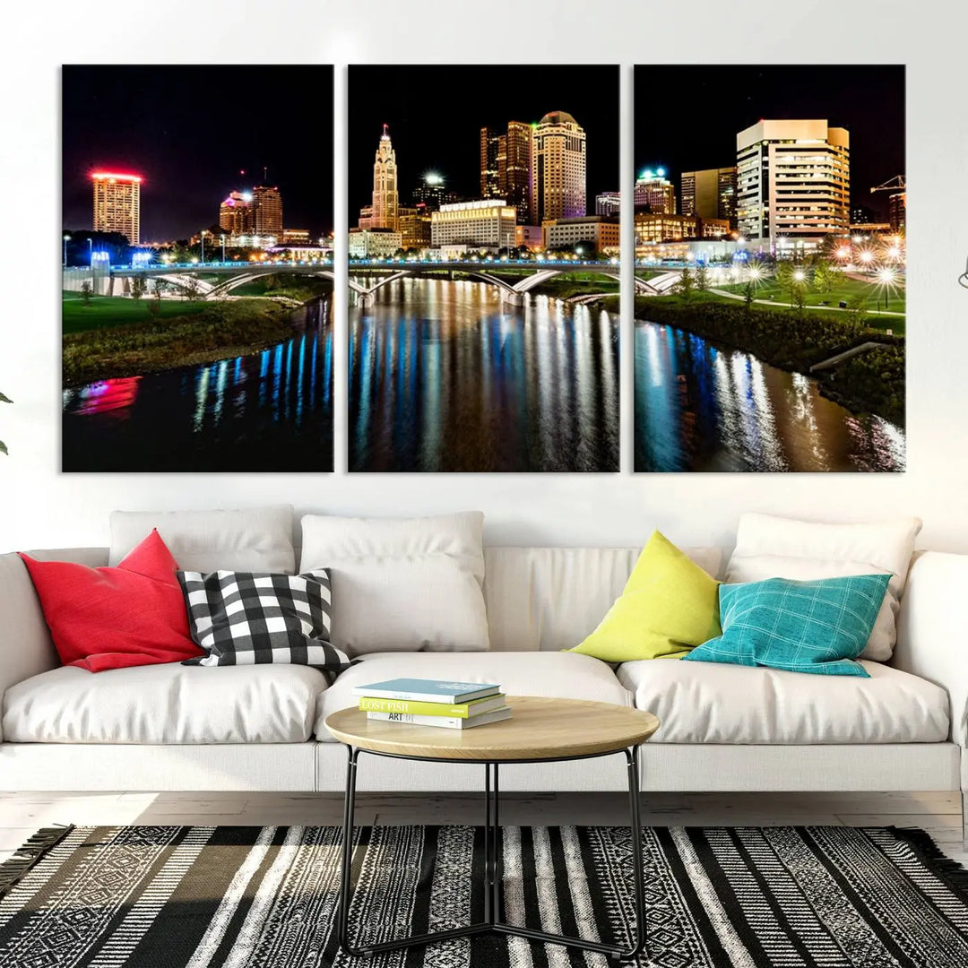 A triptych of the Columbus City Lights Night Skyline Cityscape View Wall Art Canvas Print is displayed, serving as a striking focal point in the room.