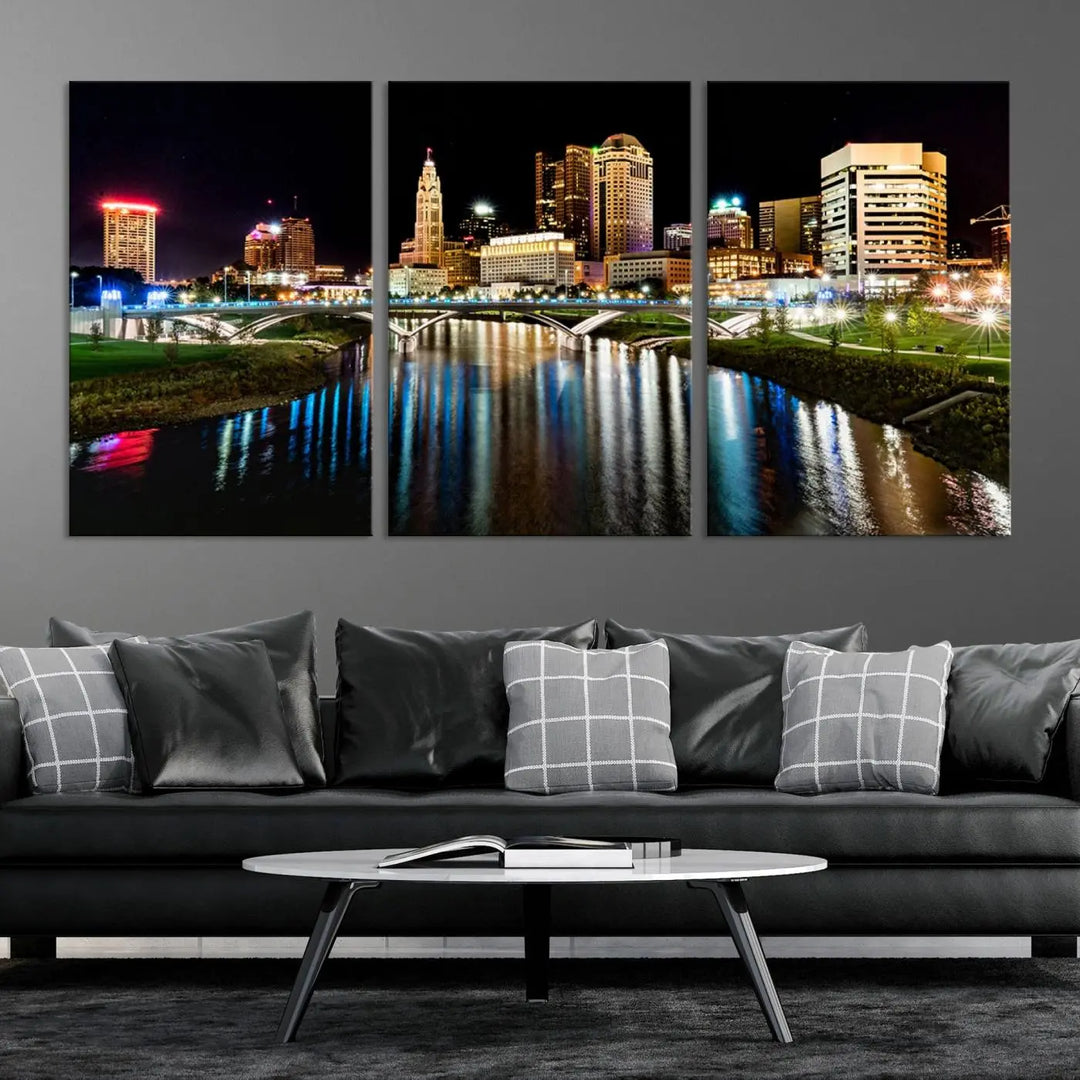 A triptych of the Columbus City Lights Night Skyline Cityscape View Wall Art Canvas Print is displayed, serving as a striking focal point in the room.