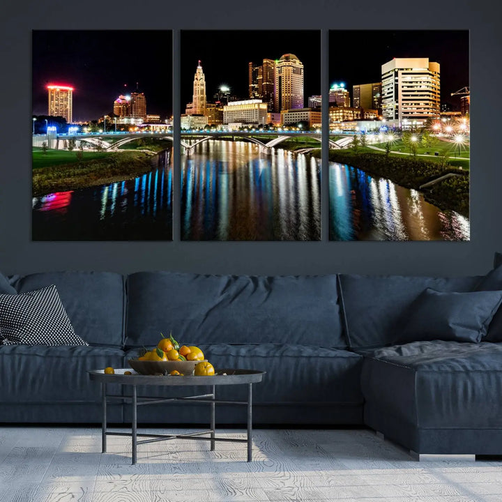 A triptych of the Columbus City Lights Night Skyline Cityscape View Wall Art Canvas Print is displayed, serving as a striking focal point in the room.