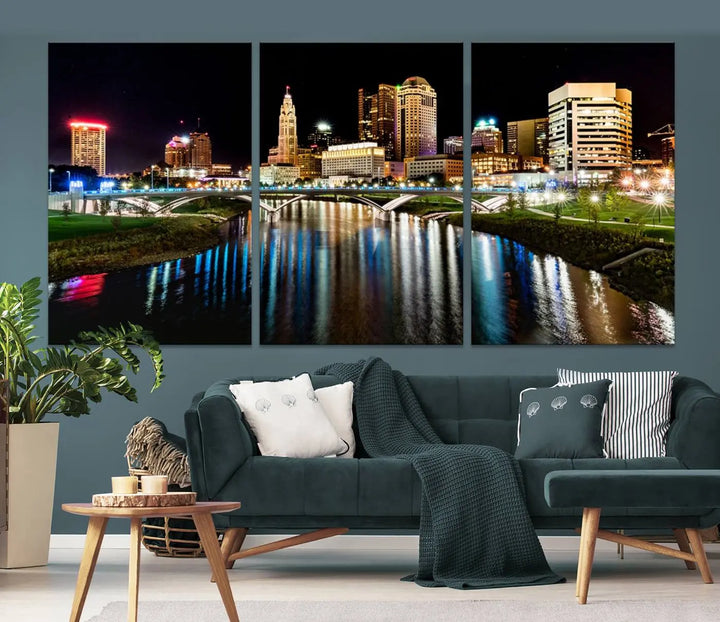 A triptych of the Columbus City Lights Night Skyline Cityscape View Wall Art Canvas Print is displayed, serving as a striking focal point in the room.