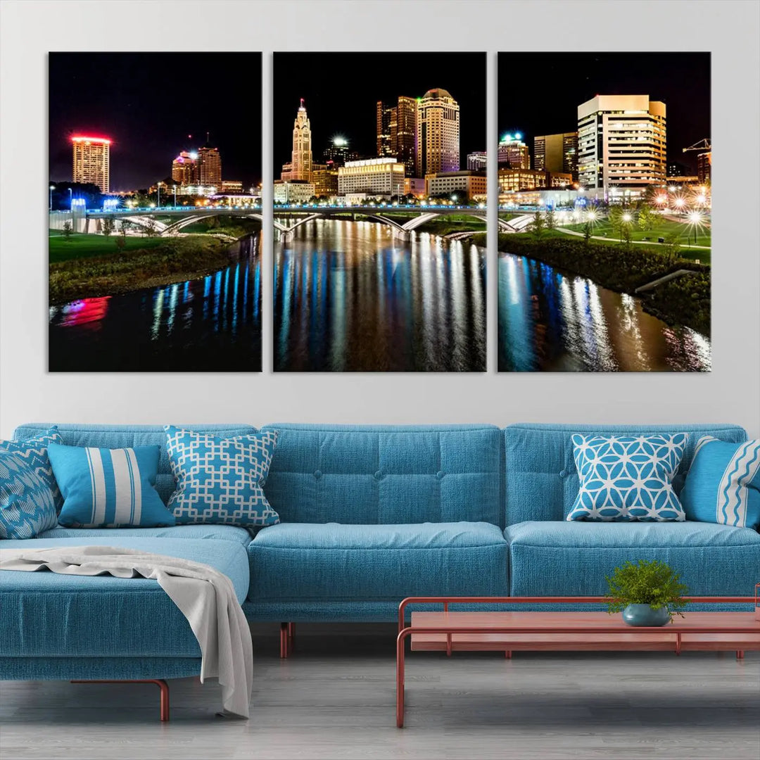 A triptych of the Columbus City Lights Night Skyline Cityscape View Wall Art Canvas Print is displayed, serving as a striking focal point in the room.