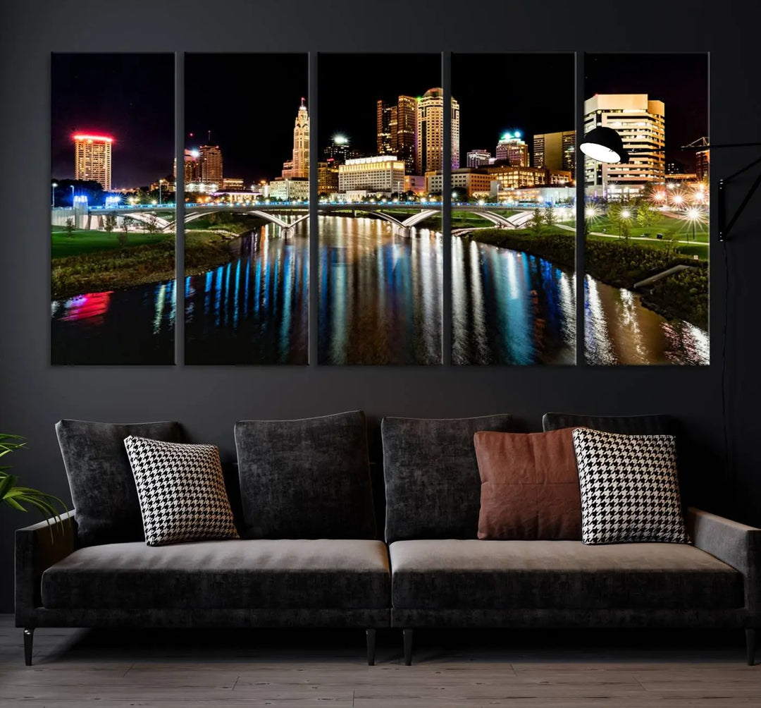 A triptych of the Columbus City Lights Night Skyline Cityscape View Wall Art Canvas Print is displayed, serving as a striking focal point in the room.