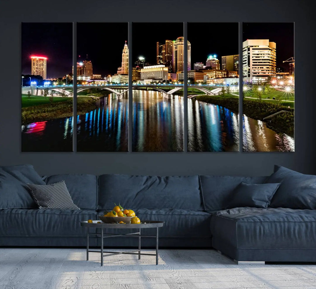 A triptych of the Columbus City Lights Night Skyline Cityscape View Wall Art Canvas Print is displayed, serving as a striking focal point in the room.