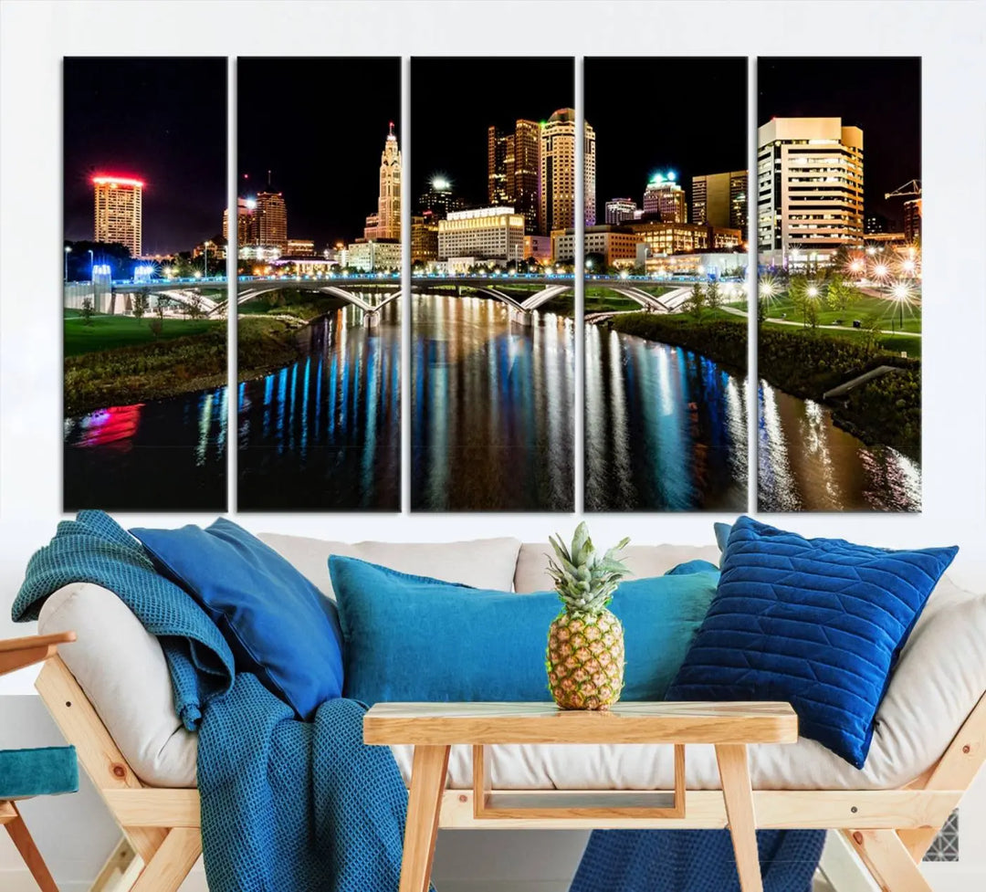 A triptych of the Columbus City Lights Night Skyline Cityscape View Wall Art Canvas Print is displayed, serving as a striking focal point in the room.