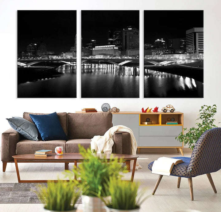 The living room features the "Columbus City Lights Skyline Black and White Wall Art Cityscape Canvas Print" above a coffee table. This artwork is presented as a triptych on museum-quality canvases with UV-protective coating.