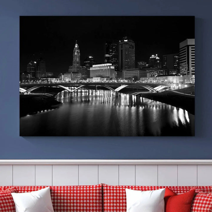 The living room features the "Columbus City Lights Skyline Black and White Wall Art Cityscape Canvas Print" above a coffee table. This artwork is presented as a triptych on museum-quality canvases with UV-protective coating.