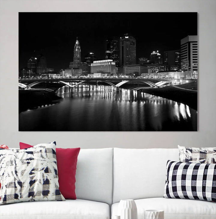 The living room features the "Columbus City Lights Skyline Black and White Wall Art Cityscape Canvas Print" above a coffee table. This artwork is presented as a triptych on museum-quality canvases with UV-protective coating.