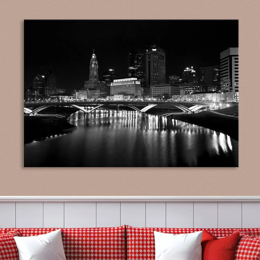 The living room features the "Columbus City Lights Skyline Black and White Wall Art Cityscape Canvas Print" above a coffee table. This artwork is presented as a triptych on museum-quality canvases with UV-protective coating.