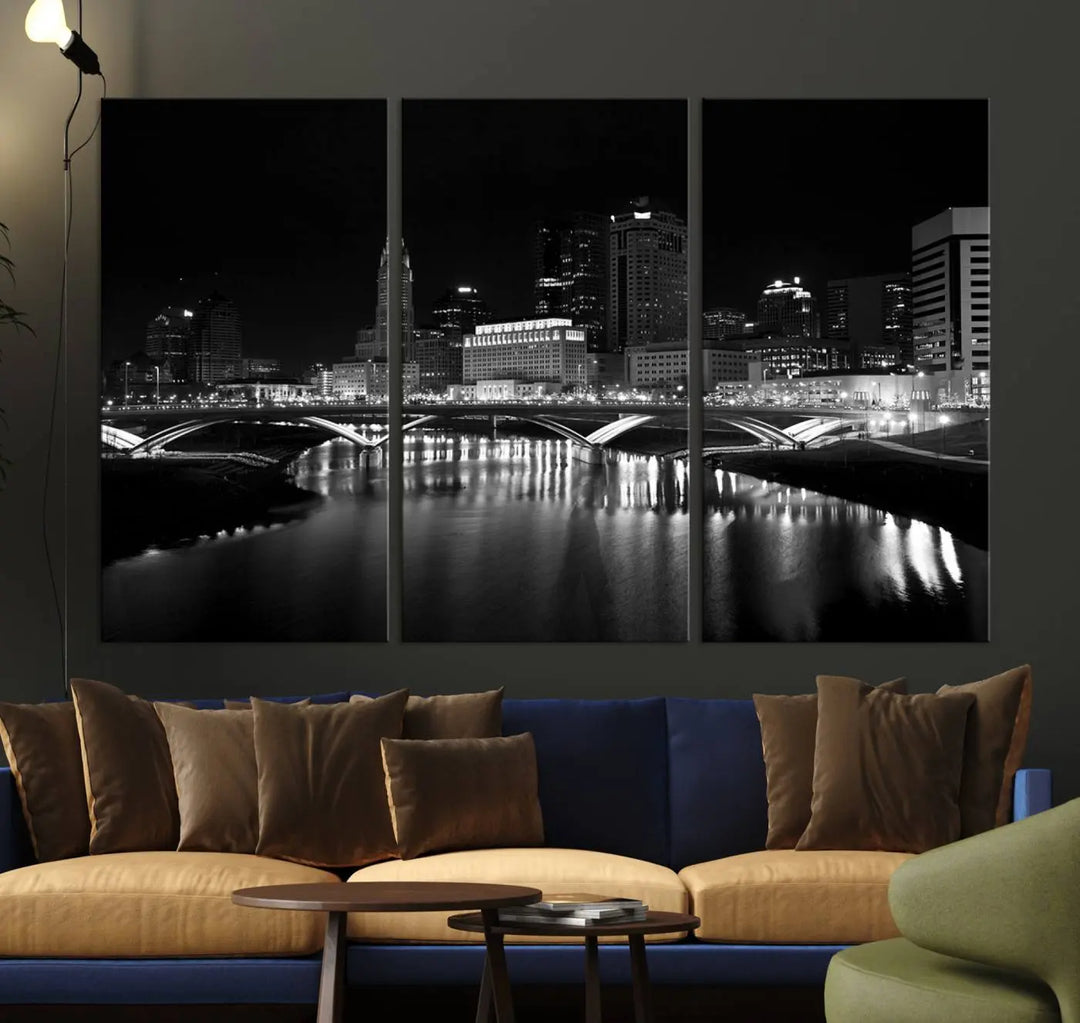 The living room features the "Columbus City Lights Skyline Black and White Wall Art Cityscape Canvas Print" above a coffee table. This artwork is presented as a triptych on museum-quality canvases with UV-protective coating.