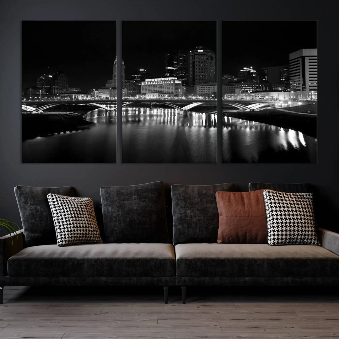 The living room features the "Columbus City Lights Skyline Black and White Wall Art Cityscape Canvas Print" above a coffee table. This artwork is presented as a triptych on museum-quality canvases with UV-protective coating.