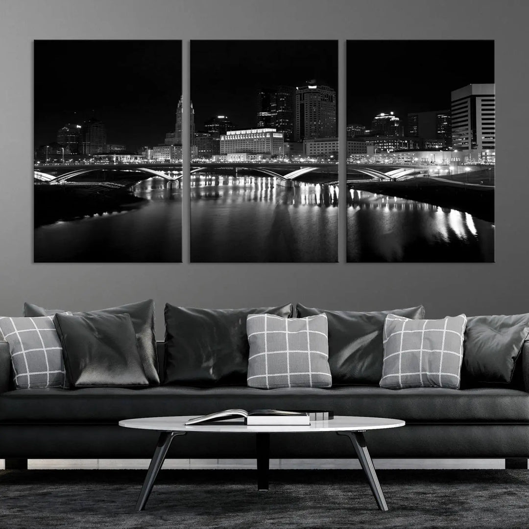 The living room features the "Columbus City Lights Skyline Black and White Wall Art Cityscape Canvas Print" above a coffee table. This artwork is presented as a triptych on museum-quality canvases with UV-protective coating.