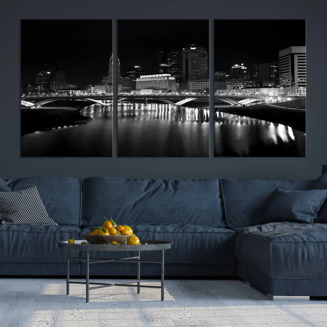 The living room features the "Columbus City Lights Skyline Black and White Wall Art Cityscape Canvas Print" above a coffee table. This artwork is presented as a triptych on museum-quality canvases with UV-protective coating.