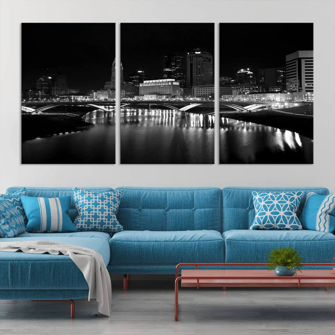 The living room features the "Columbus City Lights Skyline Black and White Wall Art Cityscape Canvas Print" above a coffee table. This artwork is presented as a triptych on museum-quality canvases with UV-protective coating.