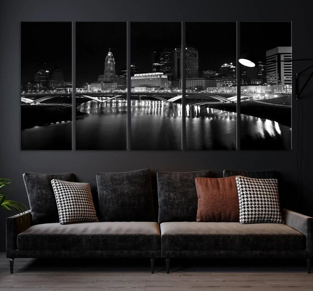 The living room features the "Columbus City Lights Skyline Black and White Wall Art Cityscape Canvas Print" above a coffee table. This artwork is presented as a triptych on museum-quality canvases with UV-protective coating.