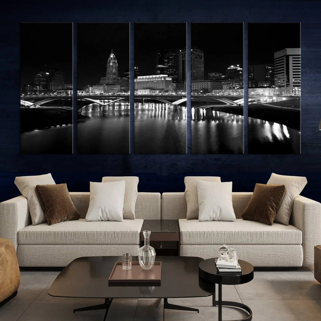 The living room features the "Columbus City Lights Skyline Black and White Wall Art Cityscape Canvas Print" above a coffee table. This artwork is presented as a triptych on museum-quality canvases with UV-protective coating.