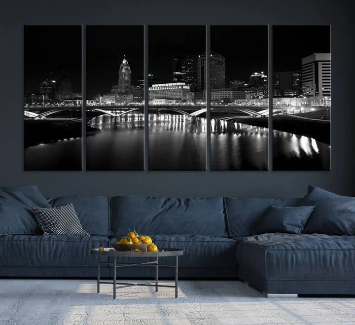 The living room features the "Columbus City Lights Skyline Black and White Wall Art Cityscape Canvas Print" above a coffee table. This artwork is presented as a triptych on museum-quality canvases with UV-protective coating.