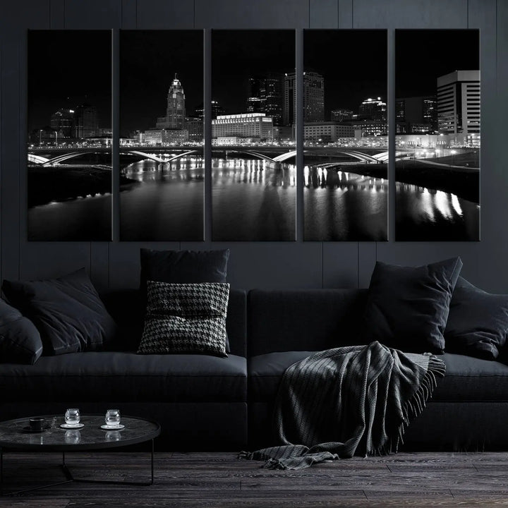 The living room features the "Columbus City Lights Skyline Black and White Wall Art Cityscape Canvas Print" above a coffee table. This artwork is presented as a triptych on museum-quality canvases with UV-protective coating.