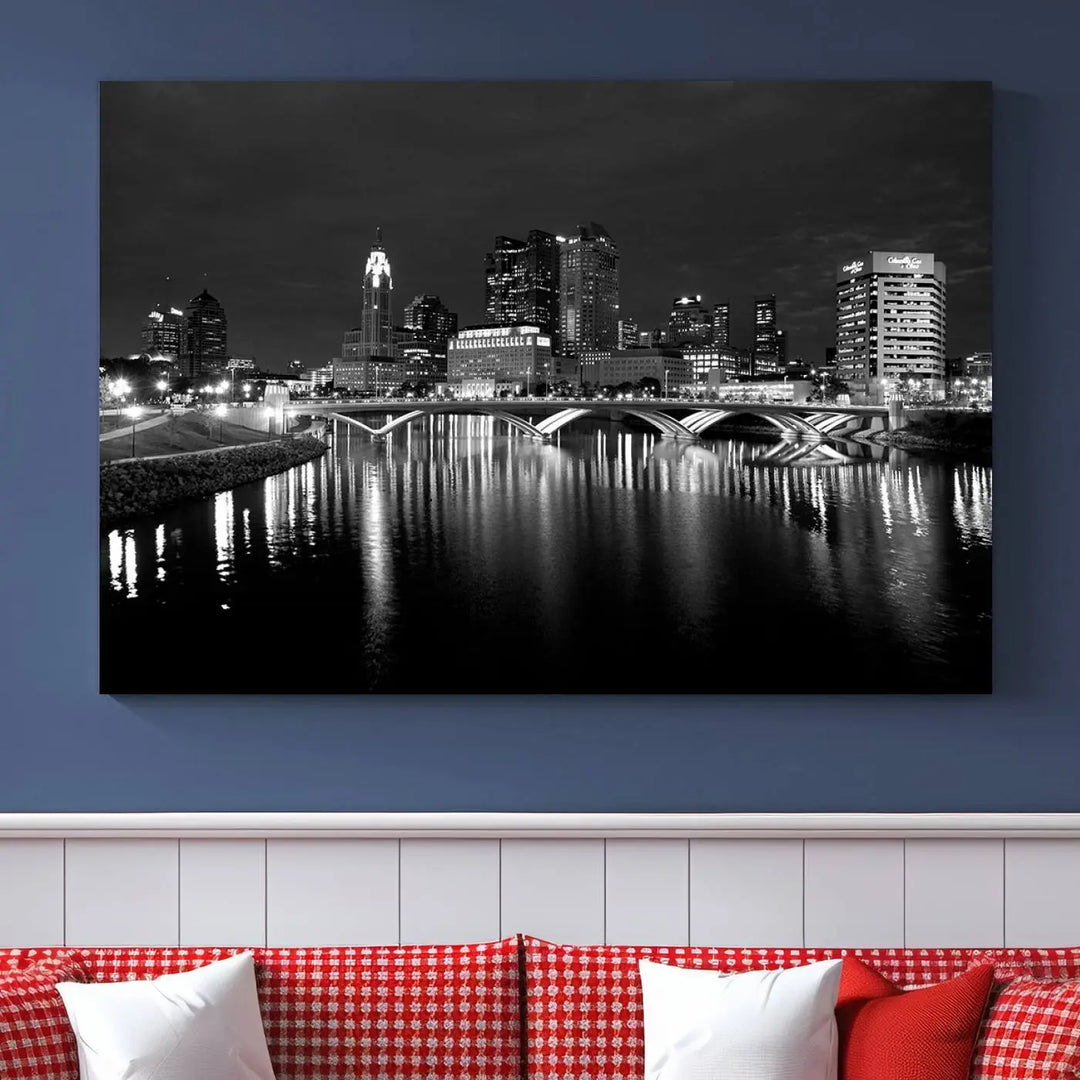 In a modern living room, the Columbus City Lights Skyline Black and White Wall Art cityscape canvas print elegantly adorns the wall above the couch. Its UV-protective coating ensures lasting elegance, and you can enjoy free shipping on this stylish centerpiece.