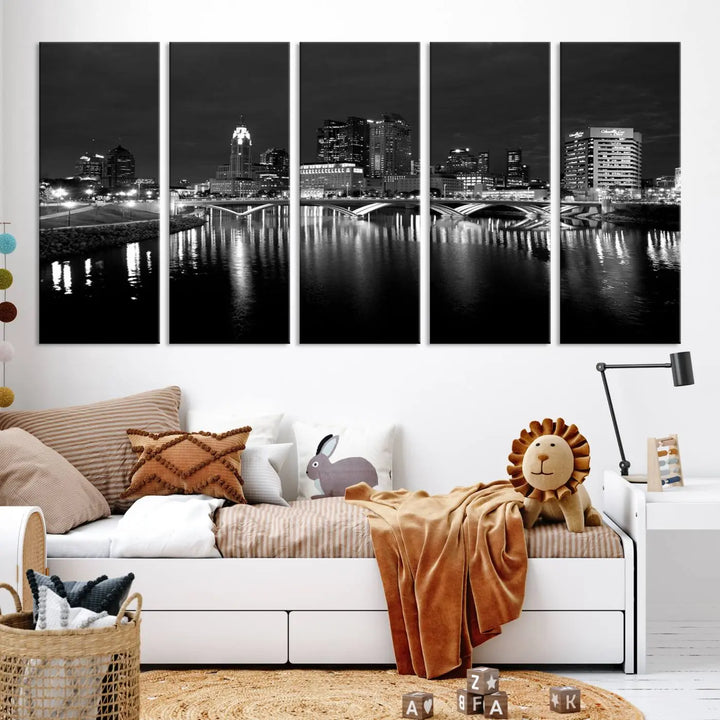 In a modern living room, the Columbus City Lights Skyline Black and White Wall Art cityscape canvas print elegantly adorns the wall above the couch. Its UV-protective coating ensures lasting elegance, and you can enjoy free shipping on this stylish centerpiece.