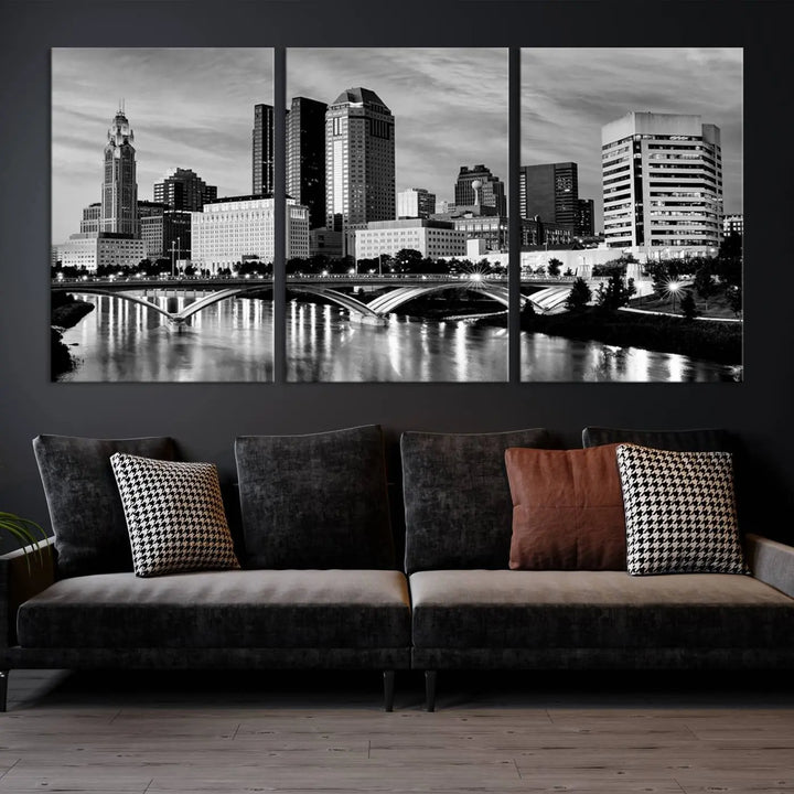 Columbus City Lights Skyline Black and White Wall Art Cityscape Canvas Print, featuring a city skyline over a river, is elegantly displayed.