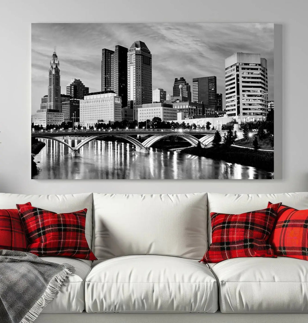 Columbus City Lights Skyline Black and White Wall Art Cityscape Canvas Print, featuring a city skyline over a river, is elegantly displayed.