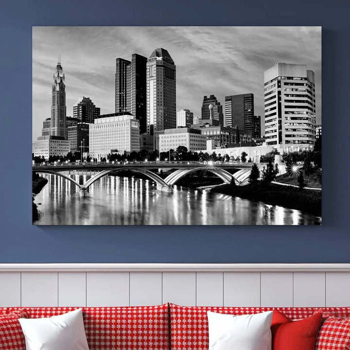 Columbus City Lights Skyline Black and White Wall Art Cityscape Canvas Print, featuring a city skyline over a river, is elegantly displayed.