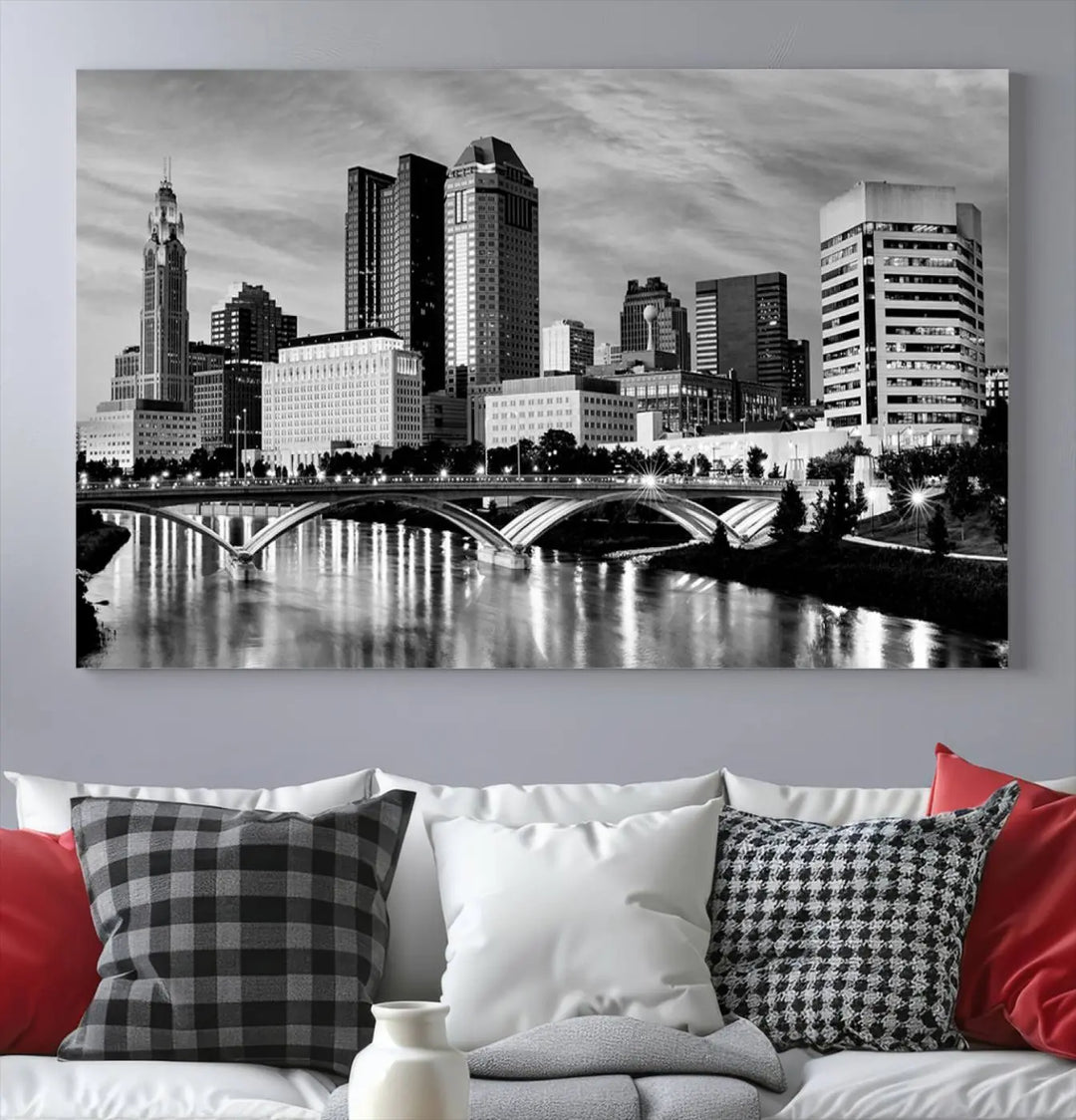 Columbus City Lights Skyline Black and White Wall Art Cityscape Canvas Print, featuring a city skyline over a river, is elegantly displayed.