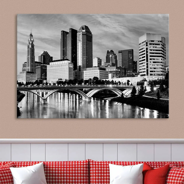 Columbus City Lights Skyline Black and White Wall Art Cityscape Canvas Print, featuring a city skyline over a river, is elegantly displayed.