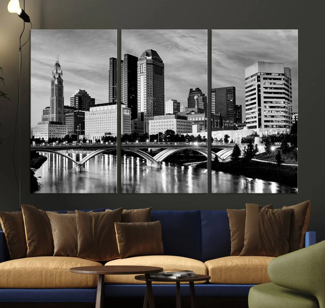 Columbus City Lights Skyline Black and White Wall Art Cityscape Canvas Print, featuring a city skyline over a river, is elegantly displayed.