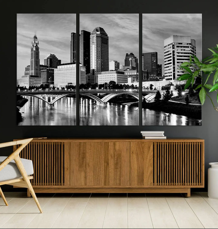 Columbus City Lights Skyline Black and White Wall Art Cityscape Canvas Print, featuring a city skyline over a river, is elegantly displayed.