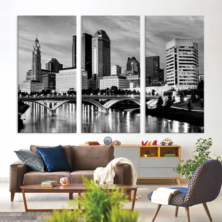 Columbus City Lights Skyline Black and White Wall Art Cityscape Canvas Print, featuring a city skyline over a river, is elegantly displayed.