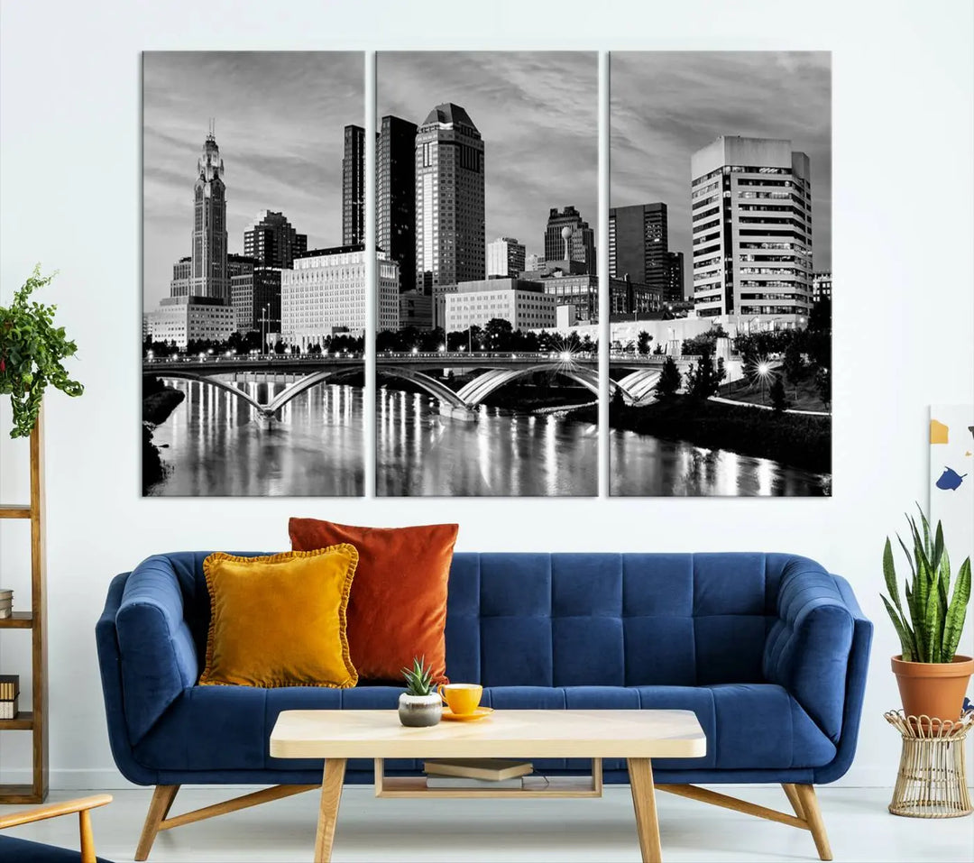 Columbus City Lights Skyline Black and White Wall Art Cityscape Canvas Print, featuring a city skyline over a river, is elegantly displayed.