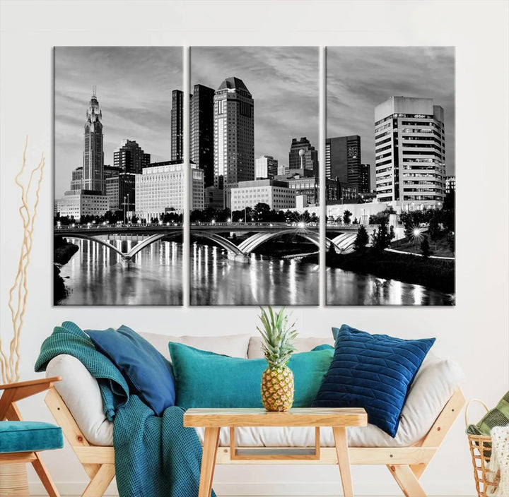 Columbus City Lights Skyline Black and White Wall Art Cityscape Canvas Print, featuring a city skyline over a river, is elegantly displayed.