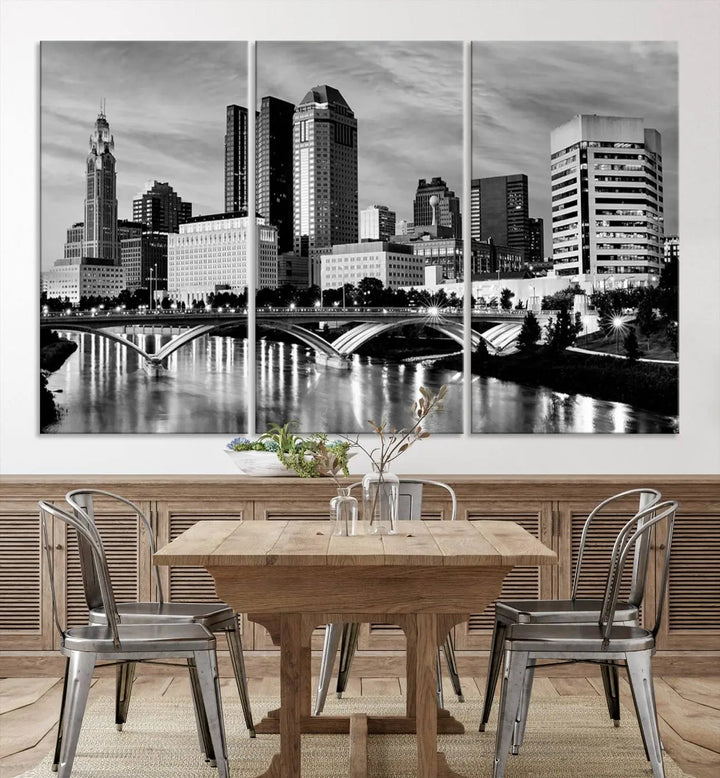 Columbus City Lights Skyline Black and White Wall Art Cityscape Canvas Print, featuring a city skyline over a river, is elegantly displayed.