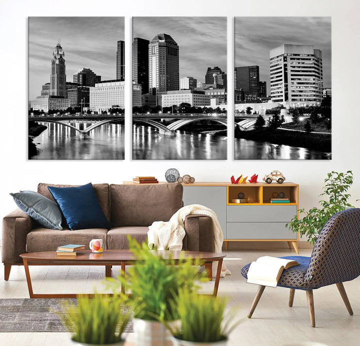 Columbus City Lights Skyline Black and White Wall Art Cityscape Canvas Print, featuring a city skyline over a river, is elegantly displayed.