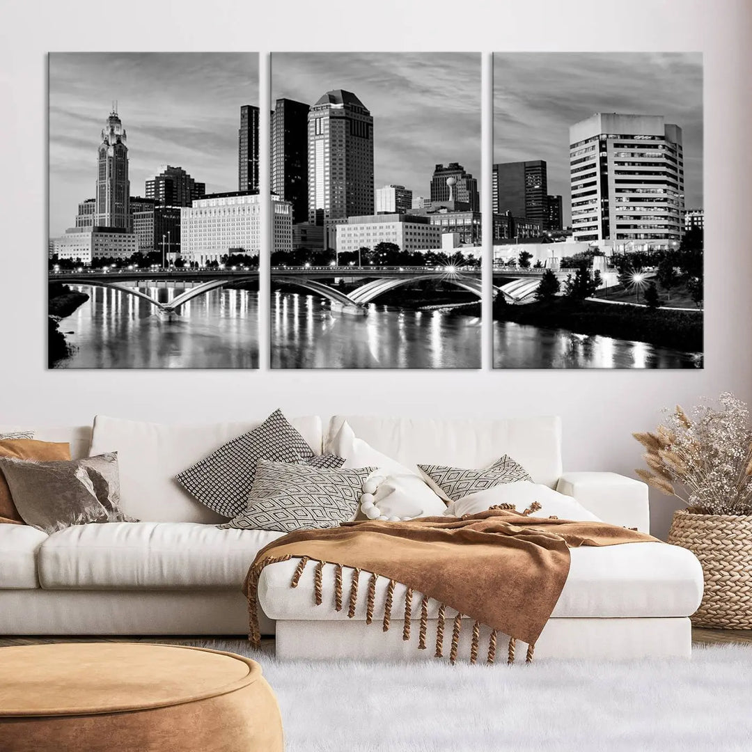 Columbus City Lights Skyline Black and White Wall Art Cityscape Canvas Print, featuring a city skyline over a river, is elegantly displayed.