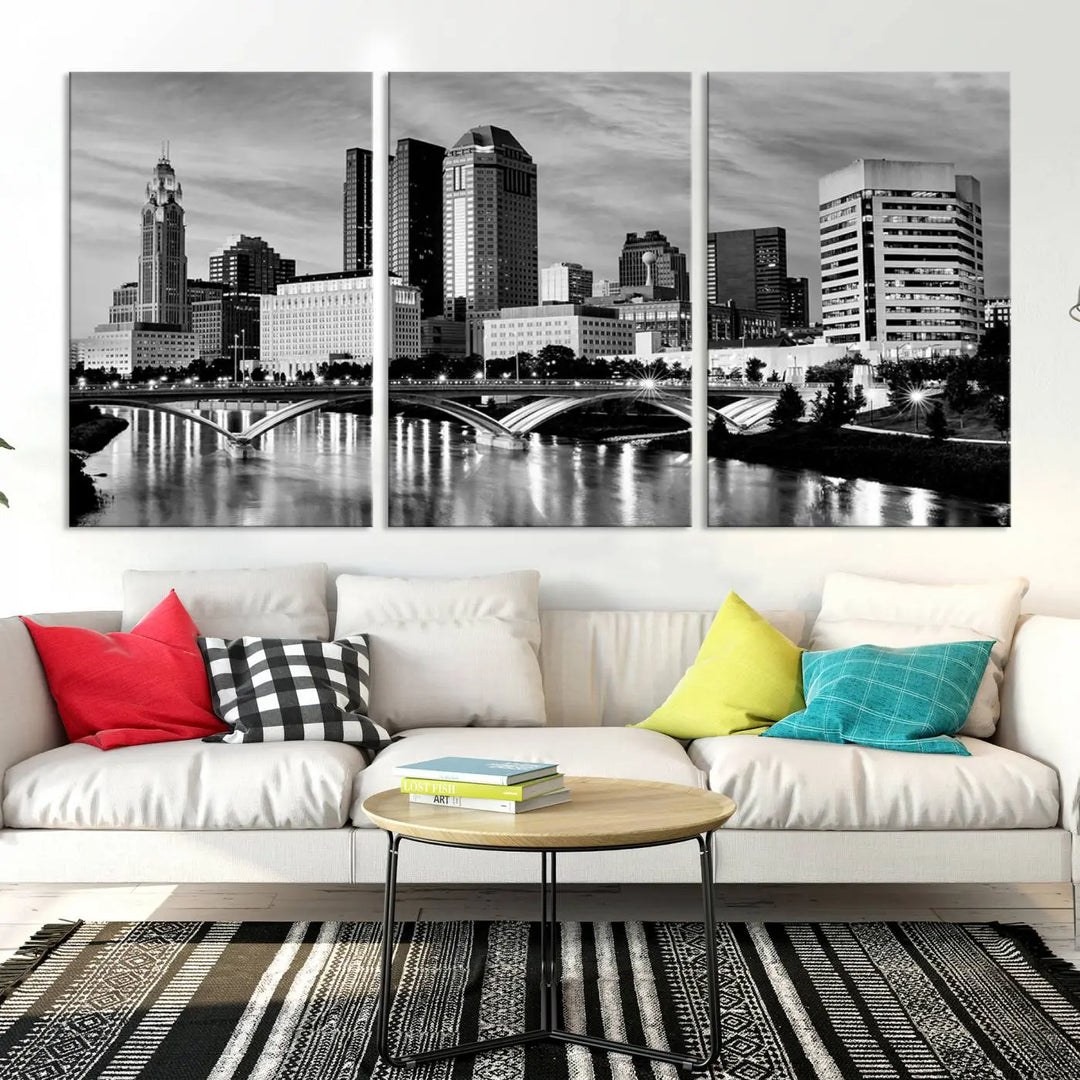 Columbus City Lights Skyline Black and White Wall Art Cityscape Canvas Print, featuring a city skyline over a river, is elegantly displayed.