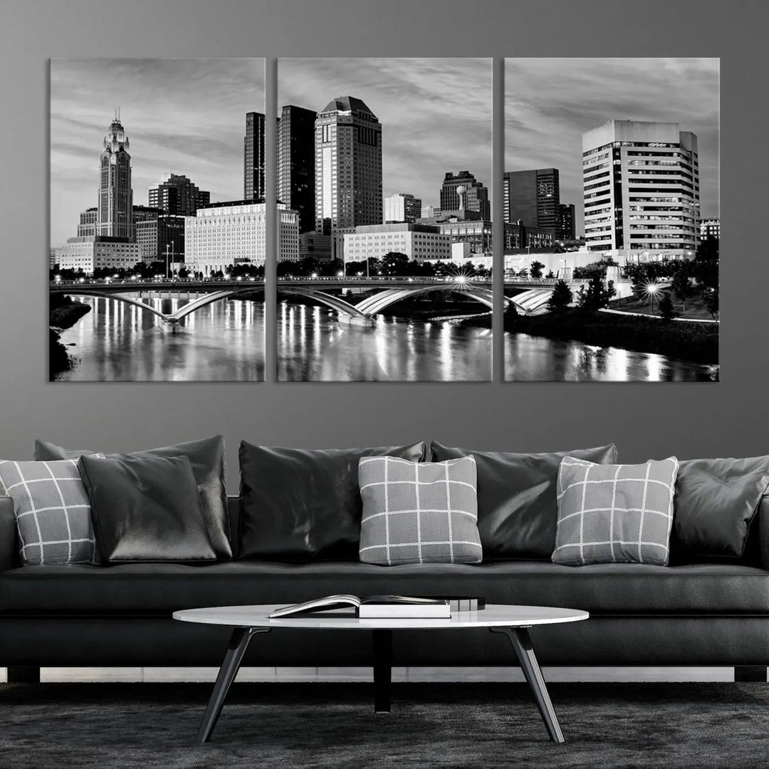 Columbus City Lights Skyline Black and White Wall Art Cityscape Canvas Print, featuring a city skyline over a river, is elegantly displayed.